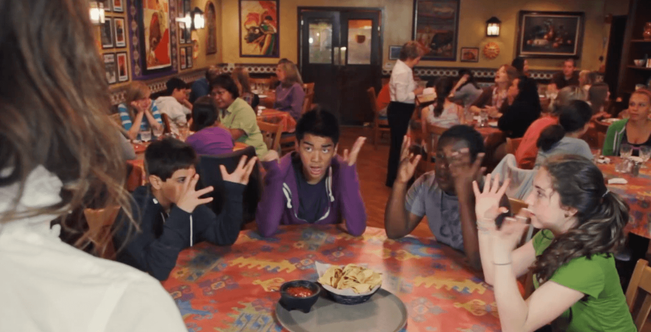 Bo and his friends trying to order bread in the original PAN music video