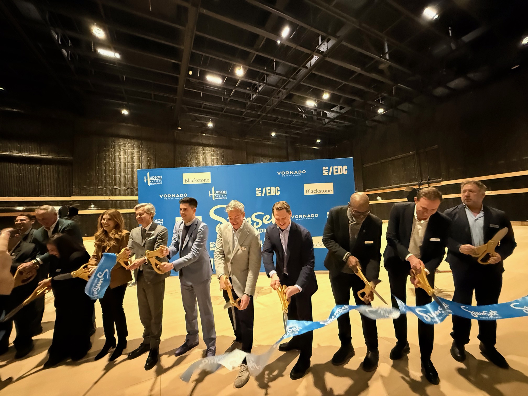 NYC Council Speaker Julie Menin, Manhattan Borough President Brad Hoylman-Sigal, and representatives from NYCEDC, Blackstone, Empire State Development, Hudson PPI, Vornado Realty Trust and MOME attend the Sunset Pier 94 Studio Ribbon Cutting Ceremony. 