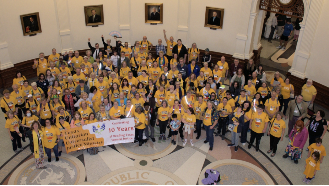 An overhead shot of the Texas UU Justice Ministry group wearing yellow shirts. 