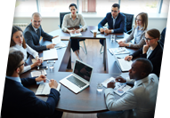 People engaged in a table top exercise meeting
