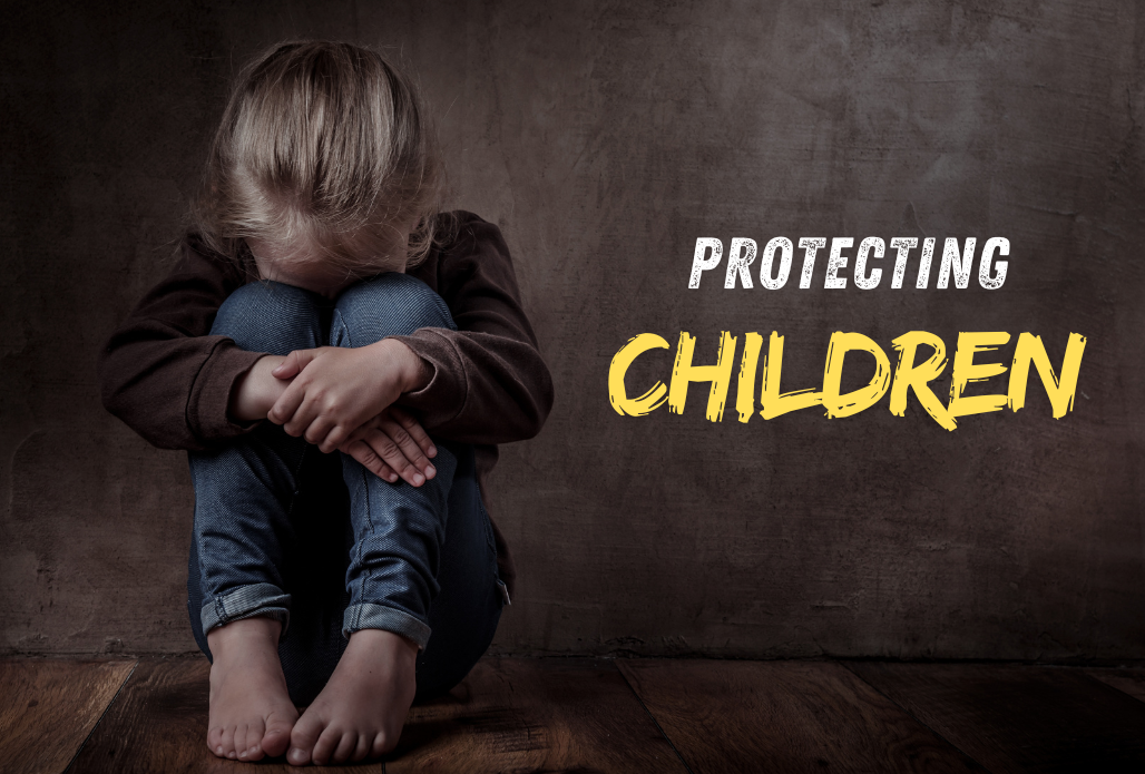Graphic of a young female chld sitting down with her head in her knees against a concrete wall and text that reads, "Protecting Children" to her right.