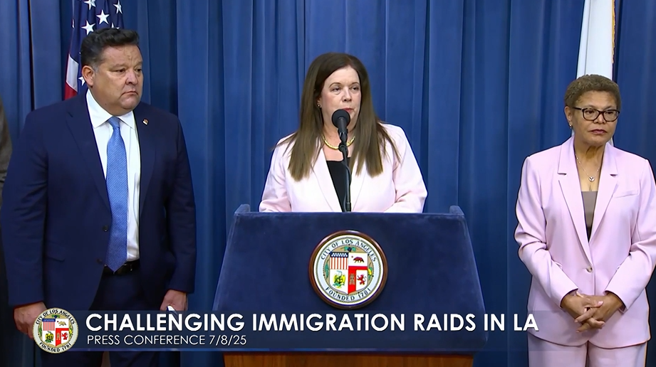 Los Angeles CIty Attorney Hydee Feldstein Soto at a podium flanked by Pasadena Mayor Victor Gordo and Los Angeles Mayor Karen Bass.