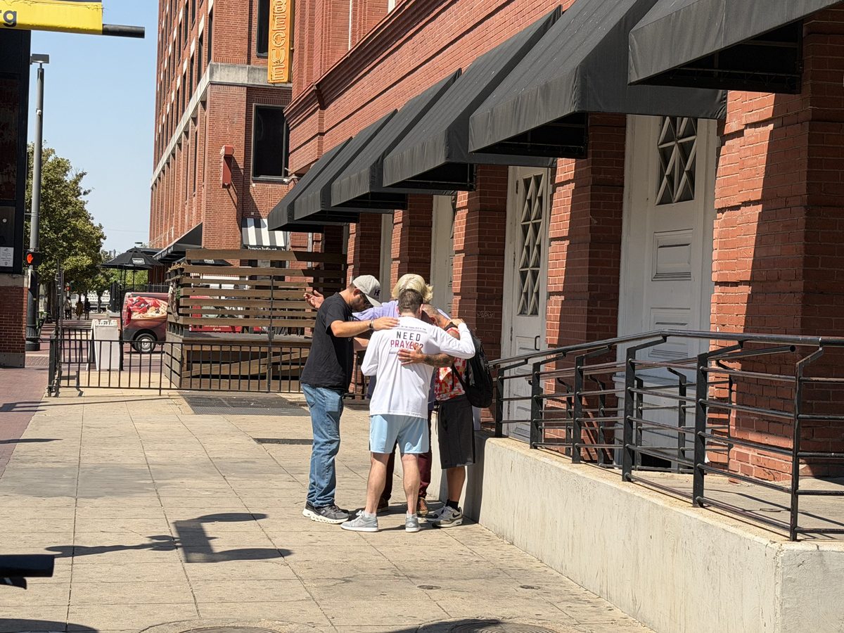 Praying with brothers downtown
