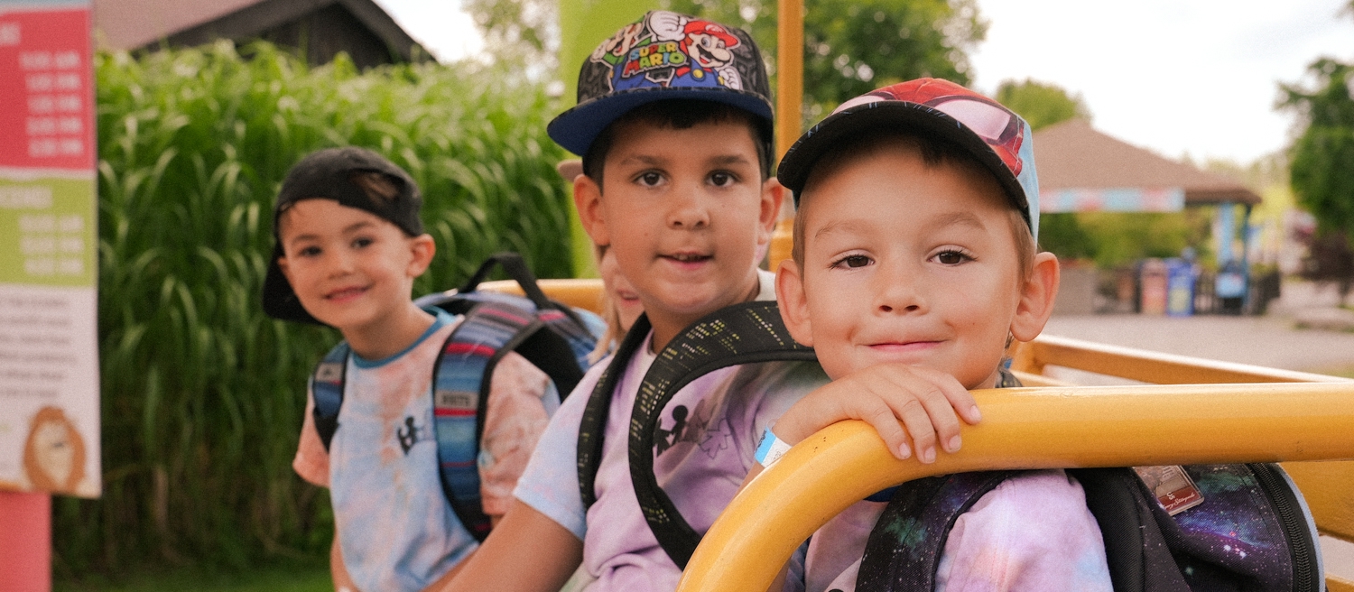 educator with two kinders outside