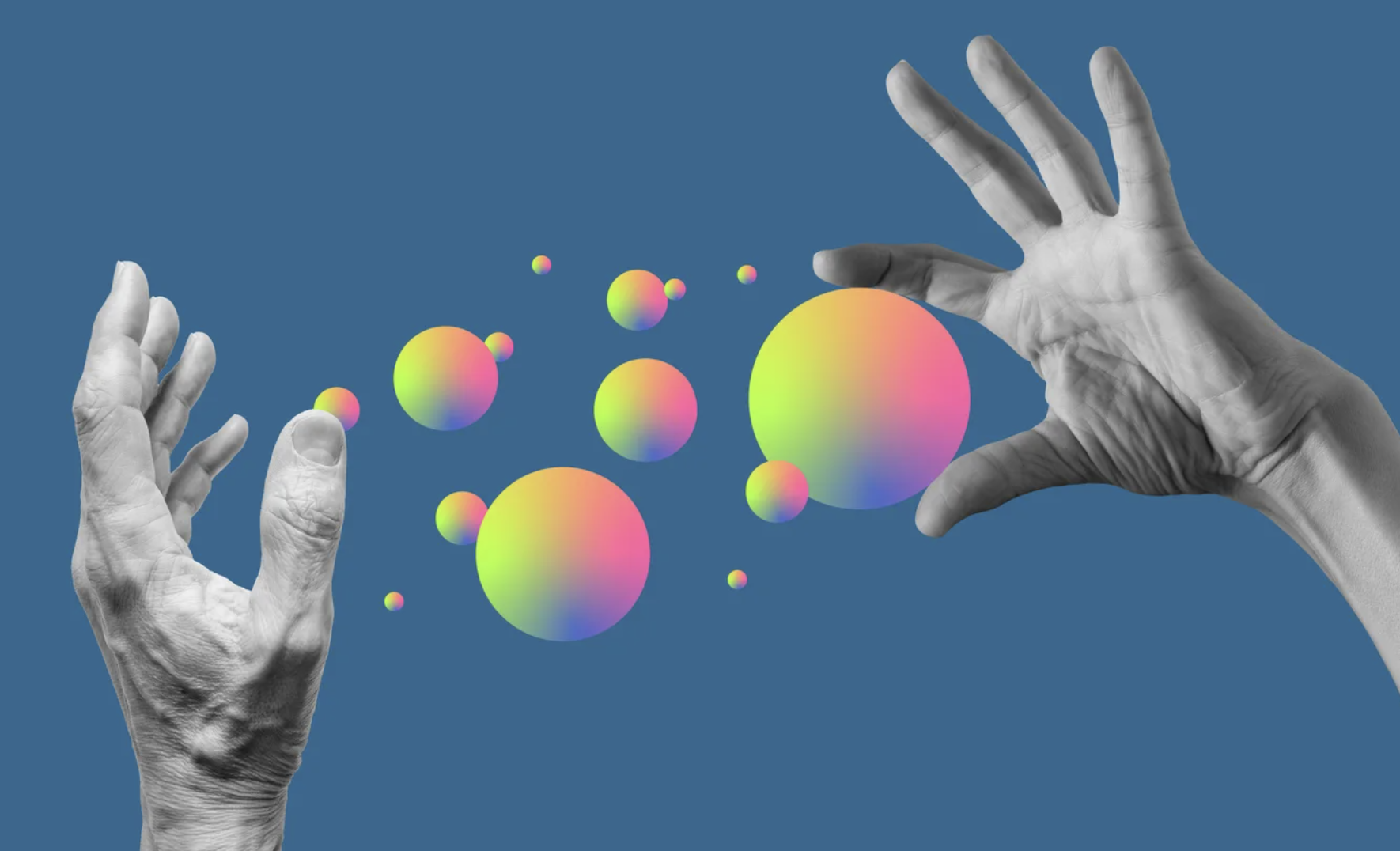 Photo illustration showing several colorful orbs suspended in space a left hand and right hand, held apart