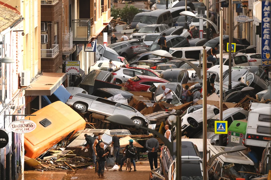 Photograph of dozens of cars piled up in a street