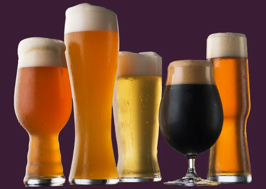 Five glasses of various sizes containing icy cold beers of various colors.