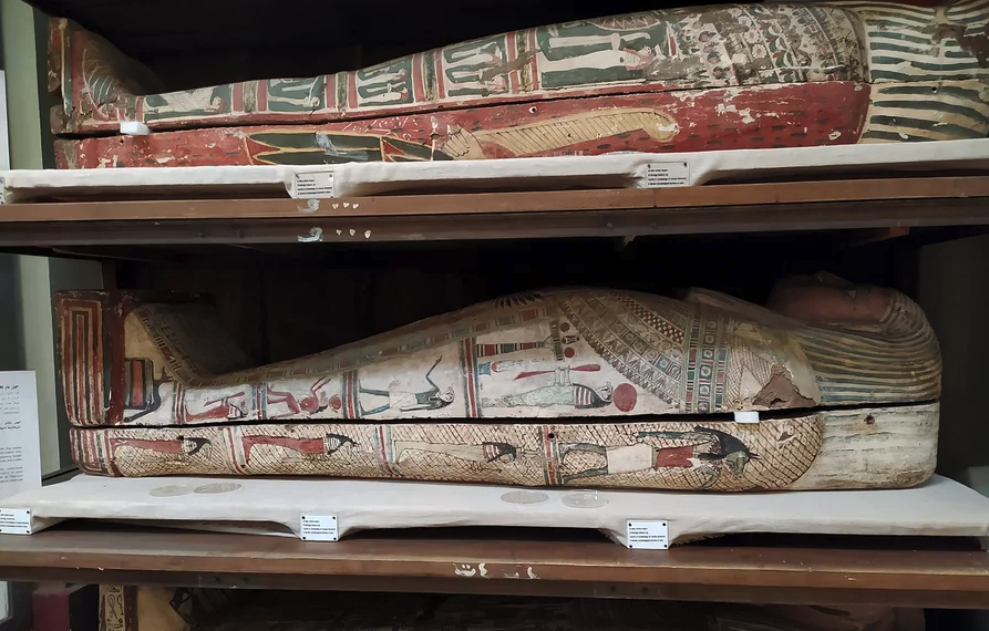Two sarcophagi on shelves