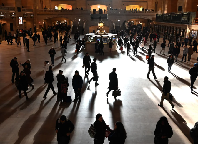 Top story image showing silhouetted people inside Grand Central Station