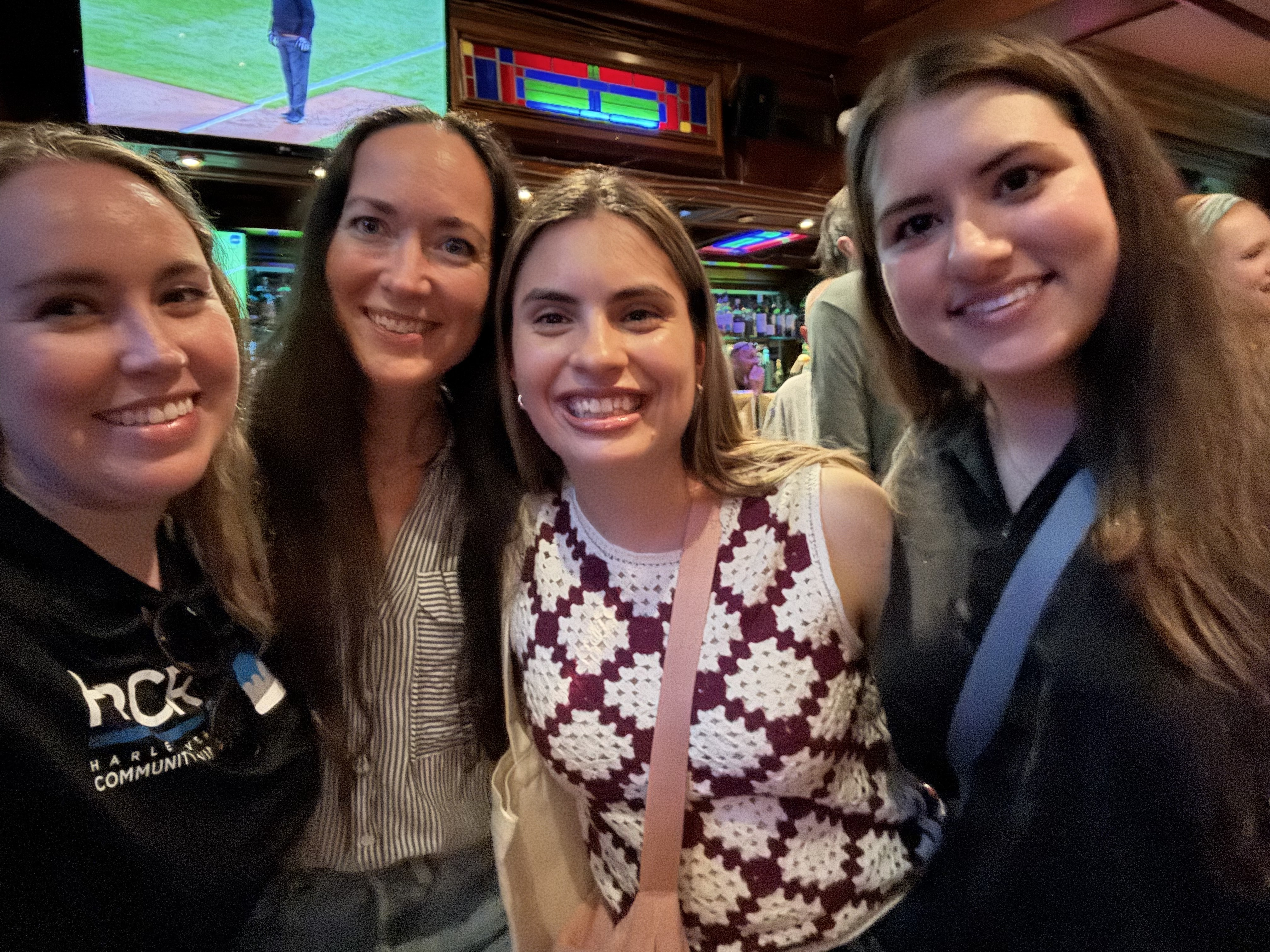 Four HRCR rowers posing for a photo at Connelly's Pub.